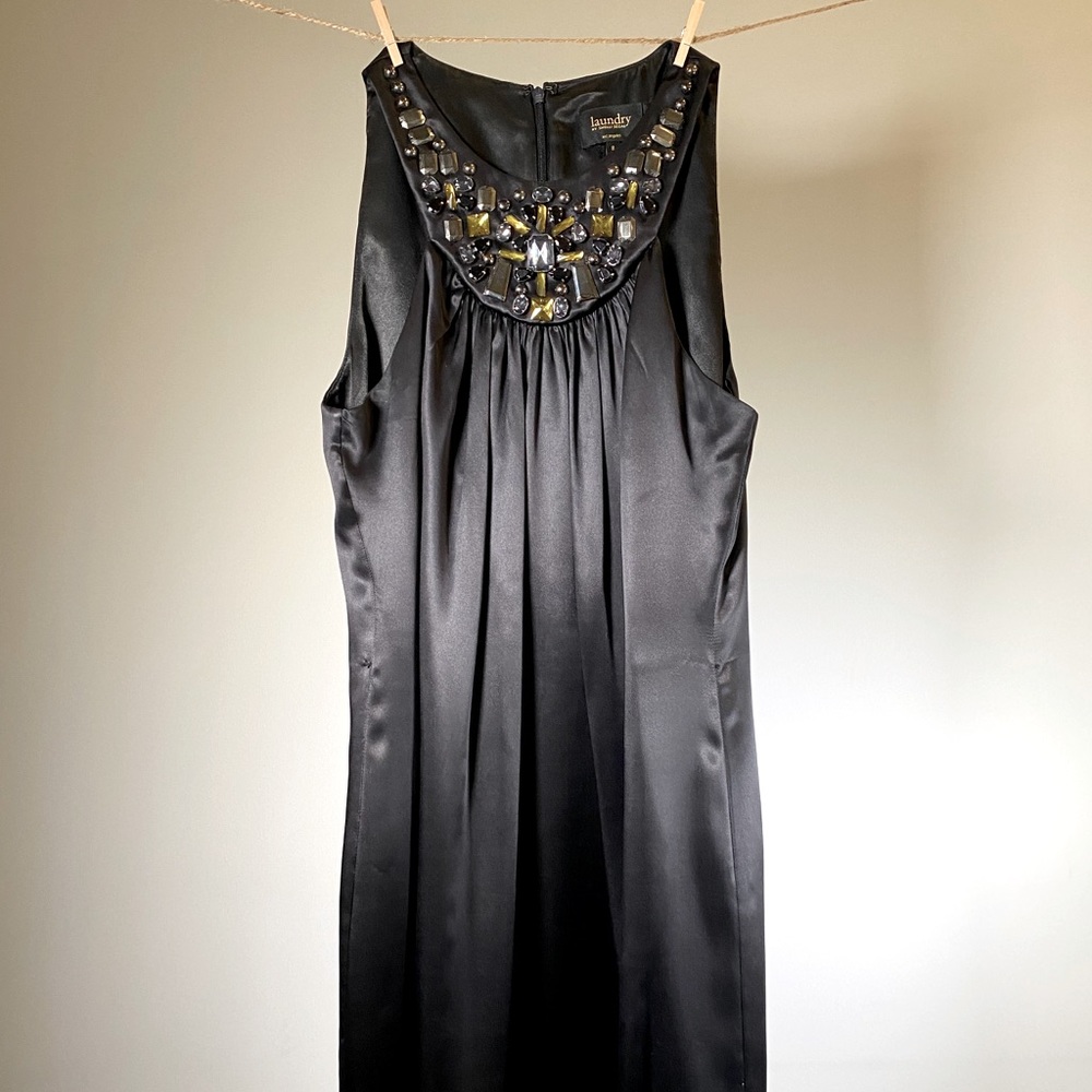 Black satin dress with detailed neckline